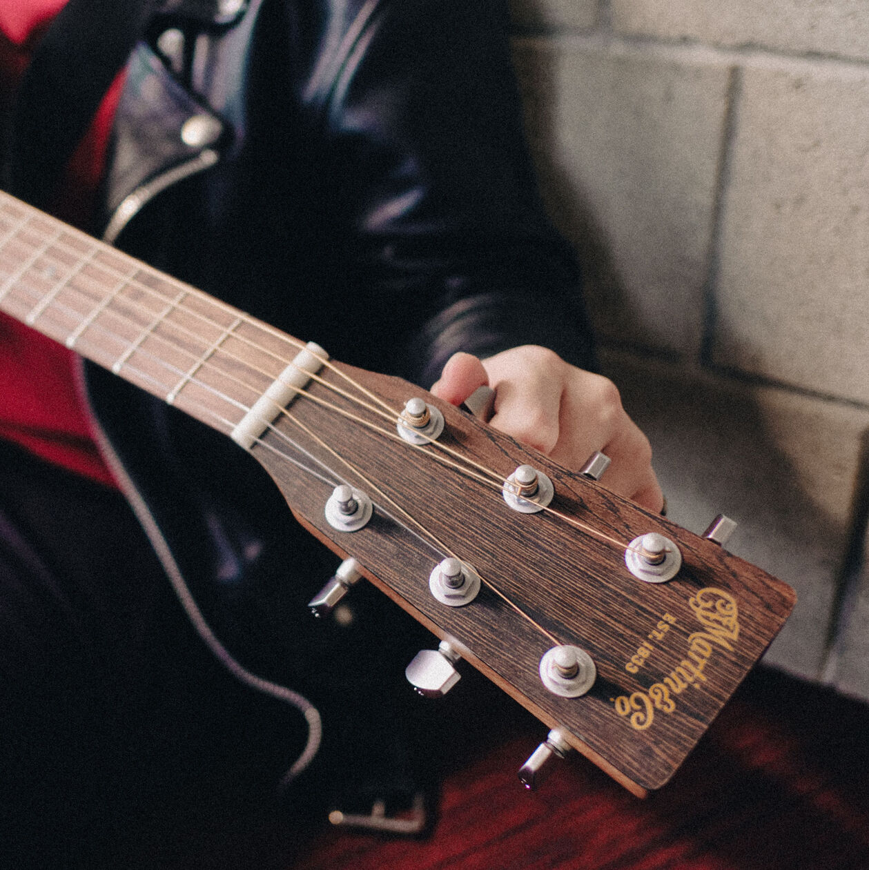 A person tuning a guitar
