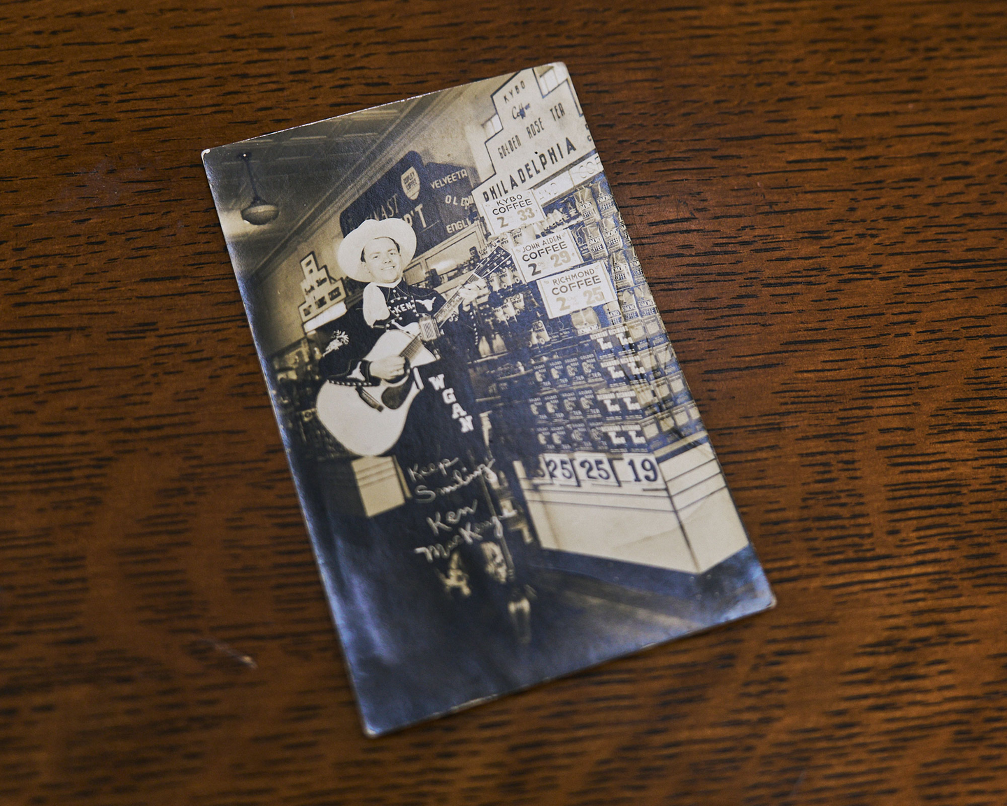 Country singer Ken MacKenzie with his 1939 Martin D-45, proudly personalized with his name inlaid in the fingerboard&mdash;captured here on a vintage promotional postcard.