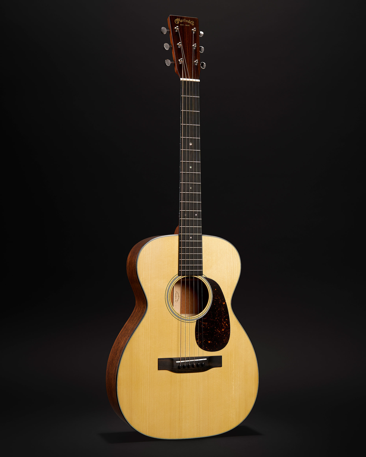 Front and back of a Martin X Series guitar