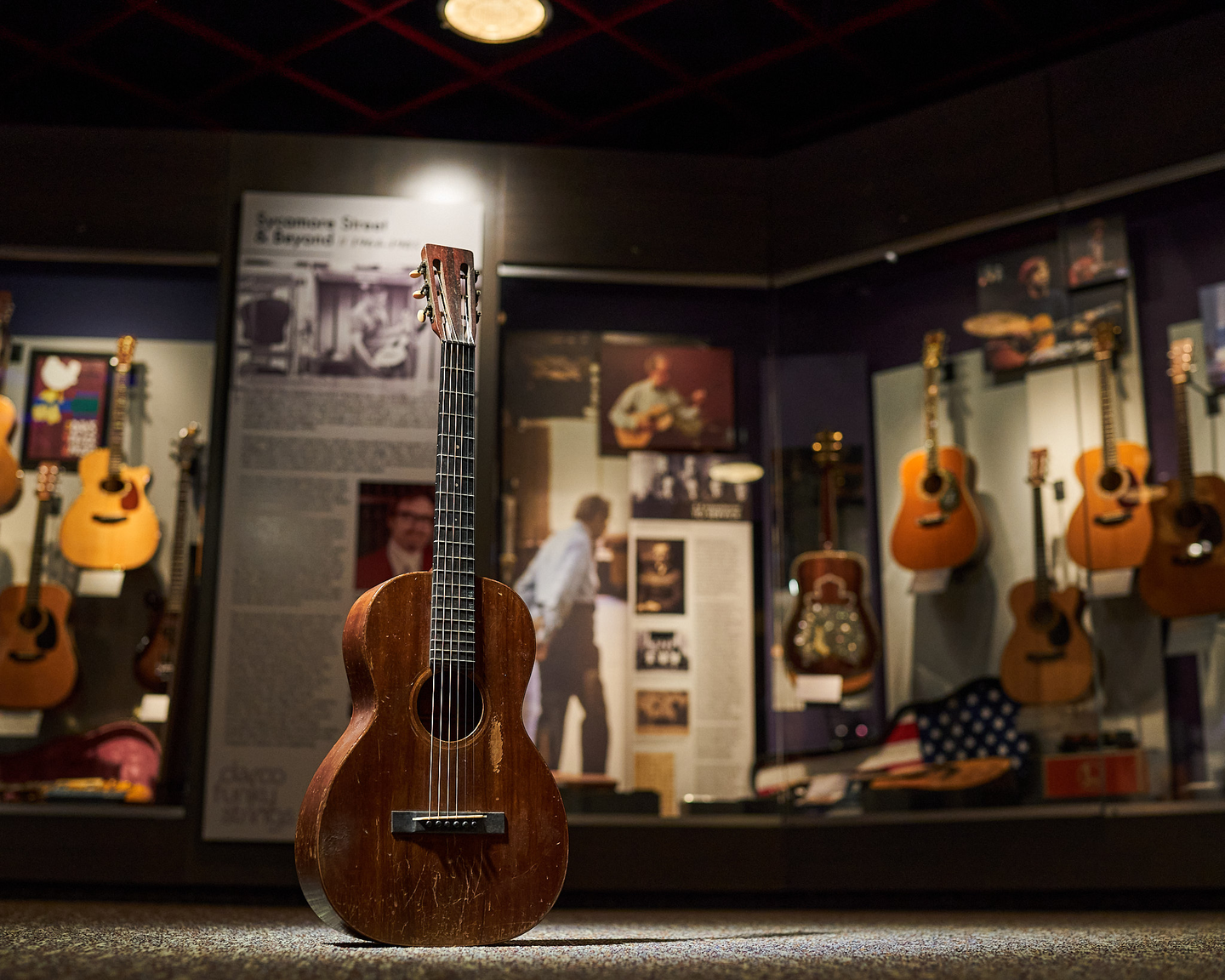 Photo of a guitar against a museum backdrop