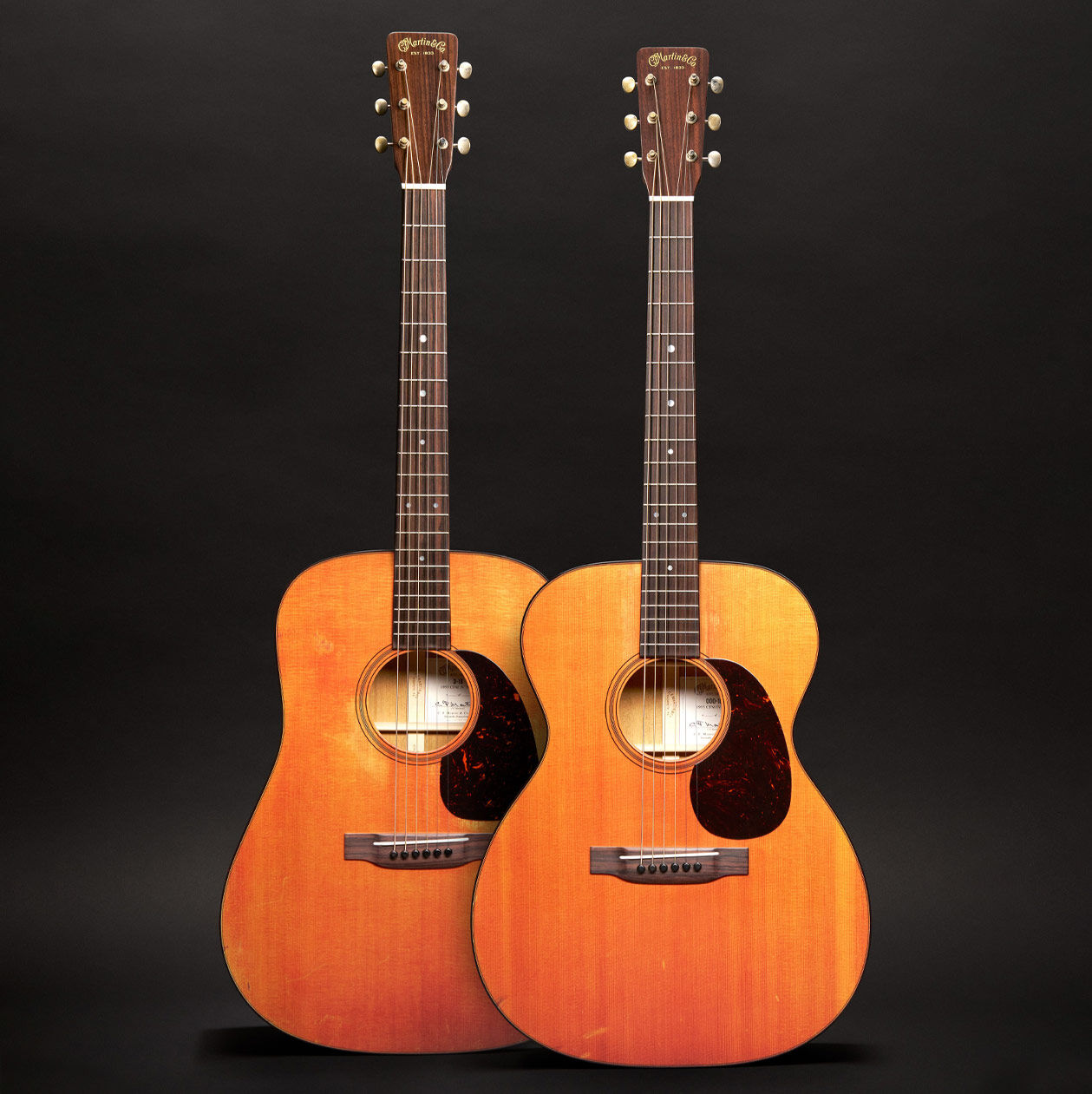 Two acoustic guitars side by side