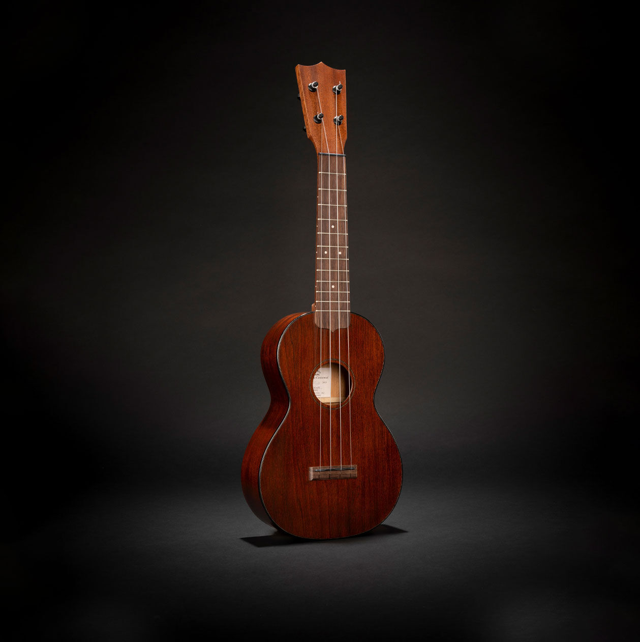 The Martin Centennial ukulele on a black background
