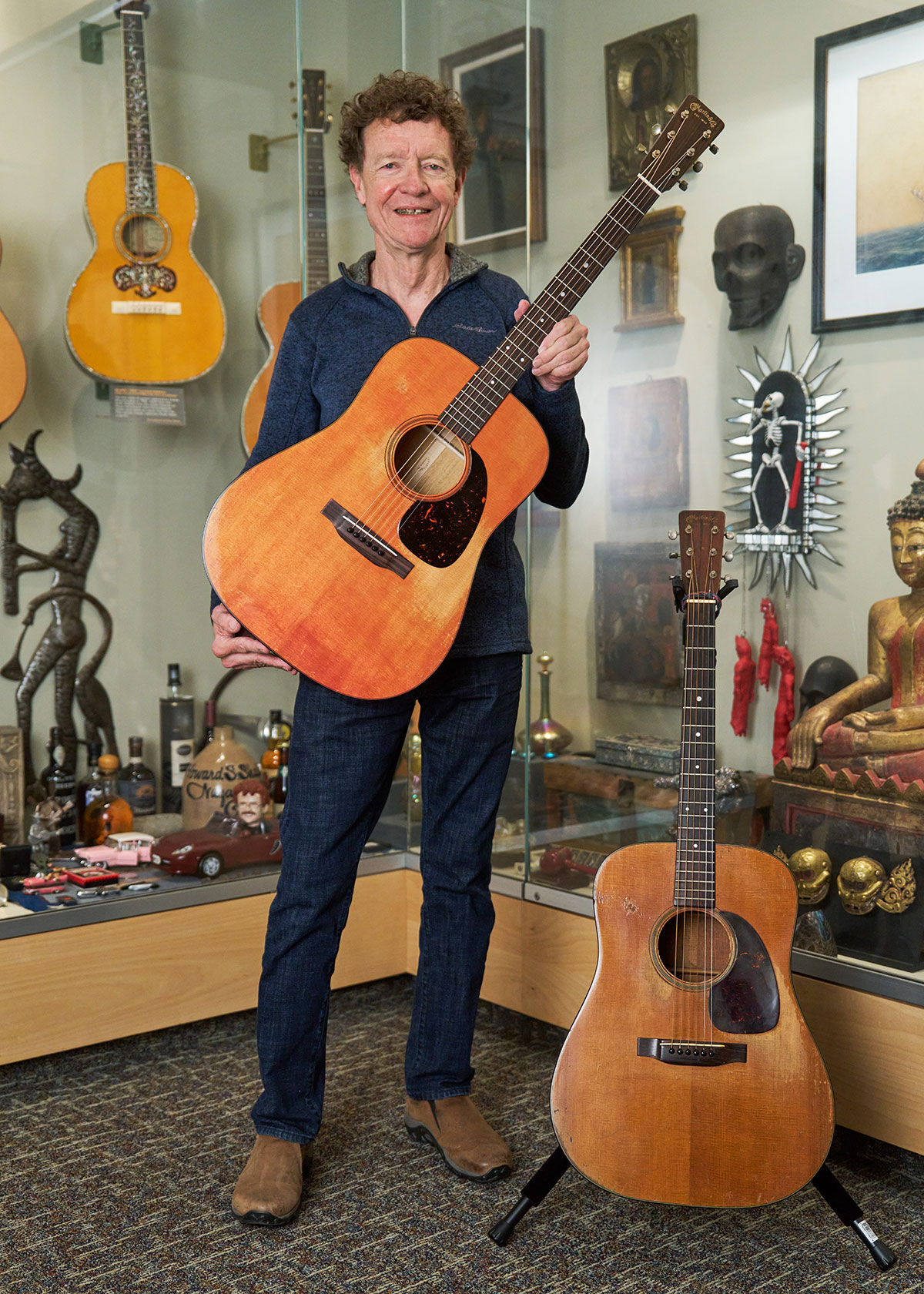 Chris Martin holding the D-18 1955 CFM IV 70th acoustic guitar
