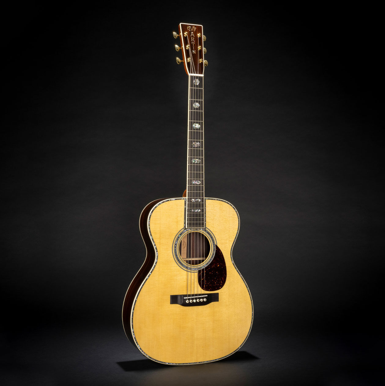 The Martin OM-45 on a black background.
