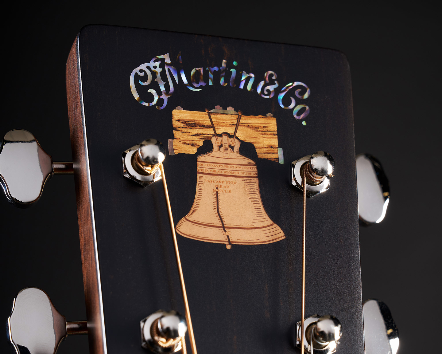 Close up of the liberty bell on a Martin headstock