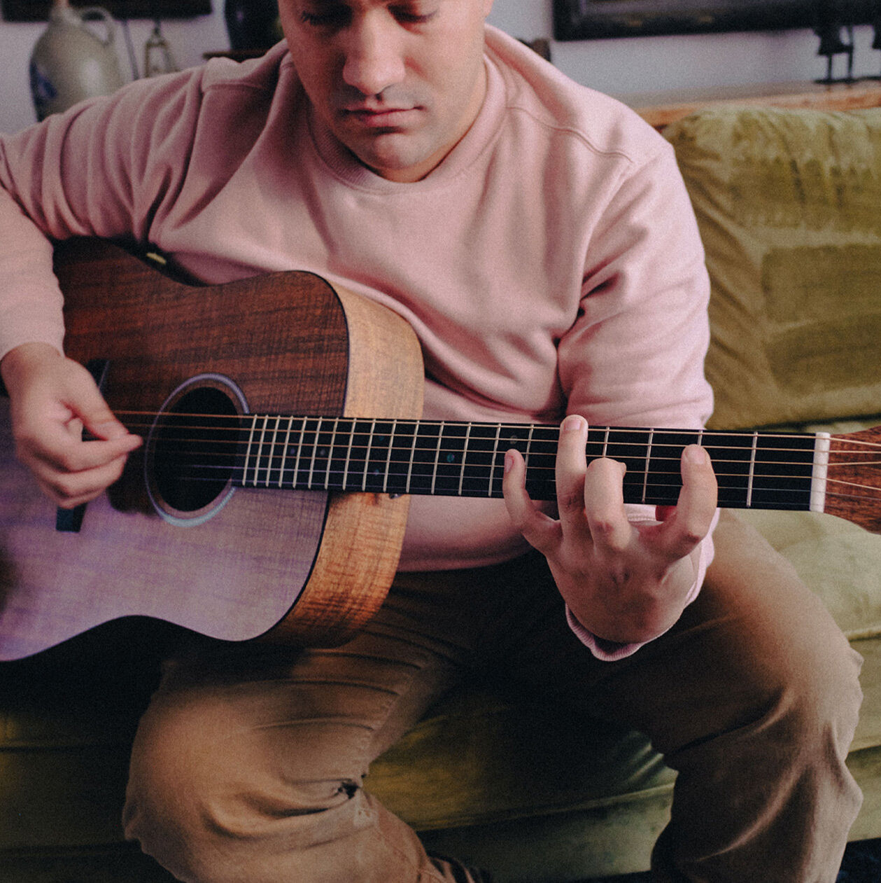 Person playing a guitar