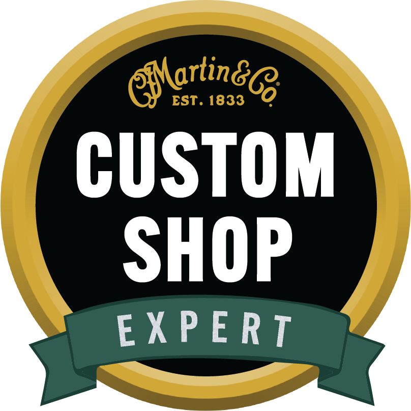 A badge that says C.F. Martin & Co Custom Shop Expert