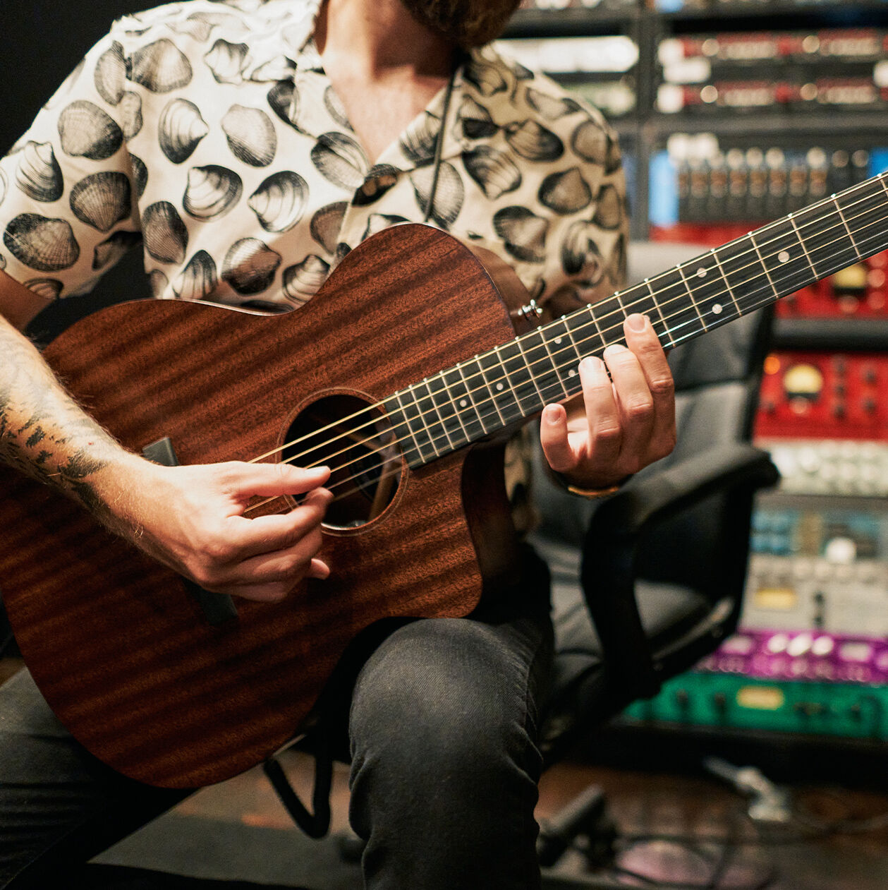 Person playing up the neck on a guitar