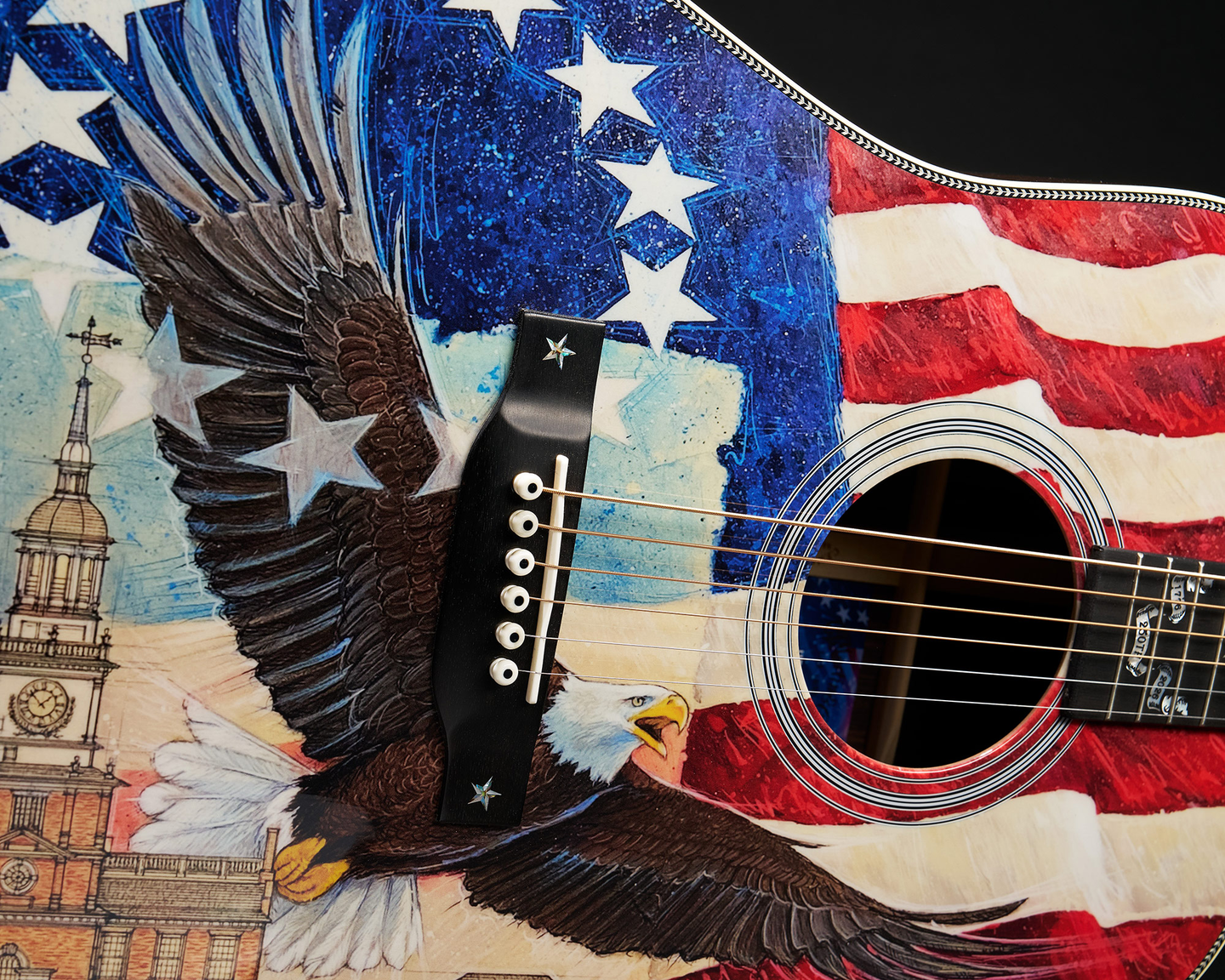 A special Martin HD-28 adorned with a bald eagle flying against an american flag