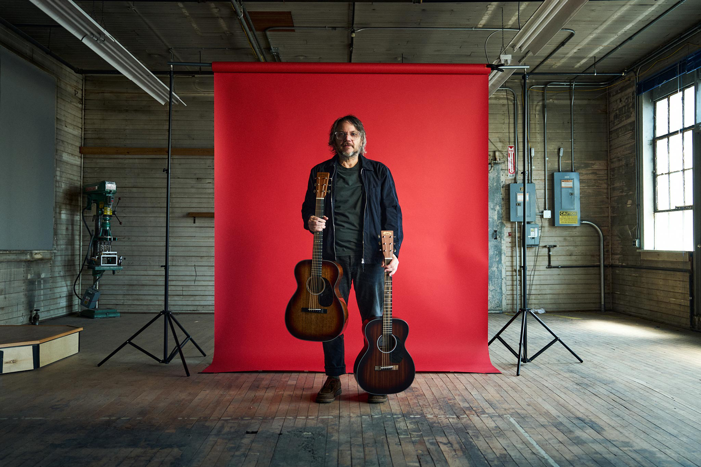 Jeff Tweedy holding his two signature models