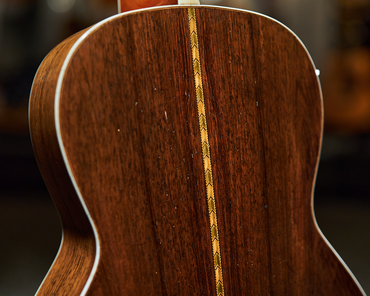 Photo of the back of an acoustic guitar