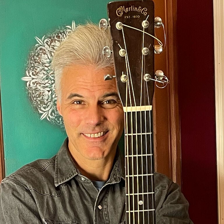 What tip would you give a new player about practicing guitar? 