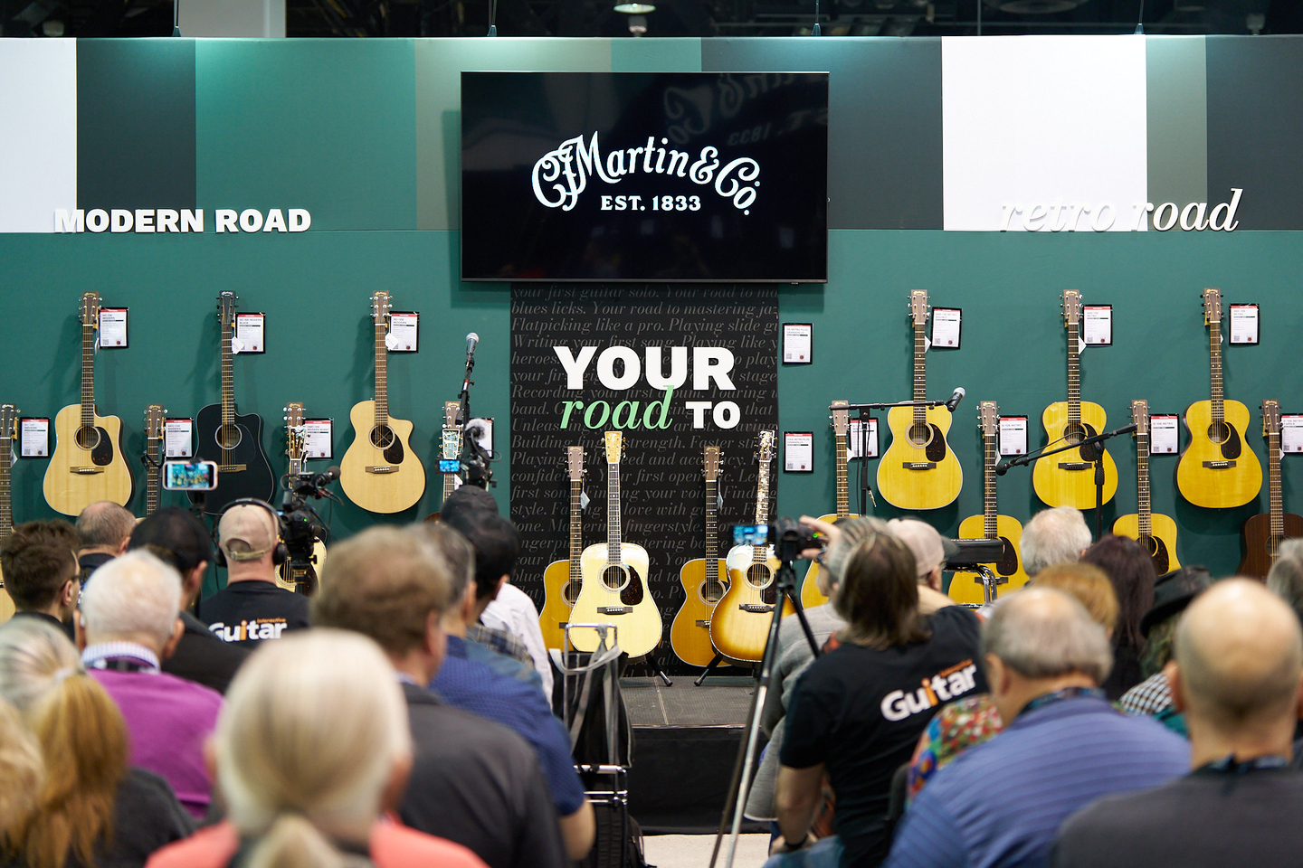Road Series guitars on the wall at NAMM