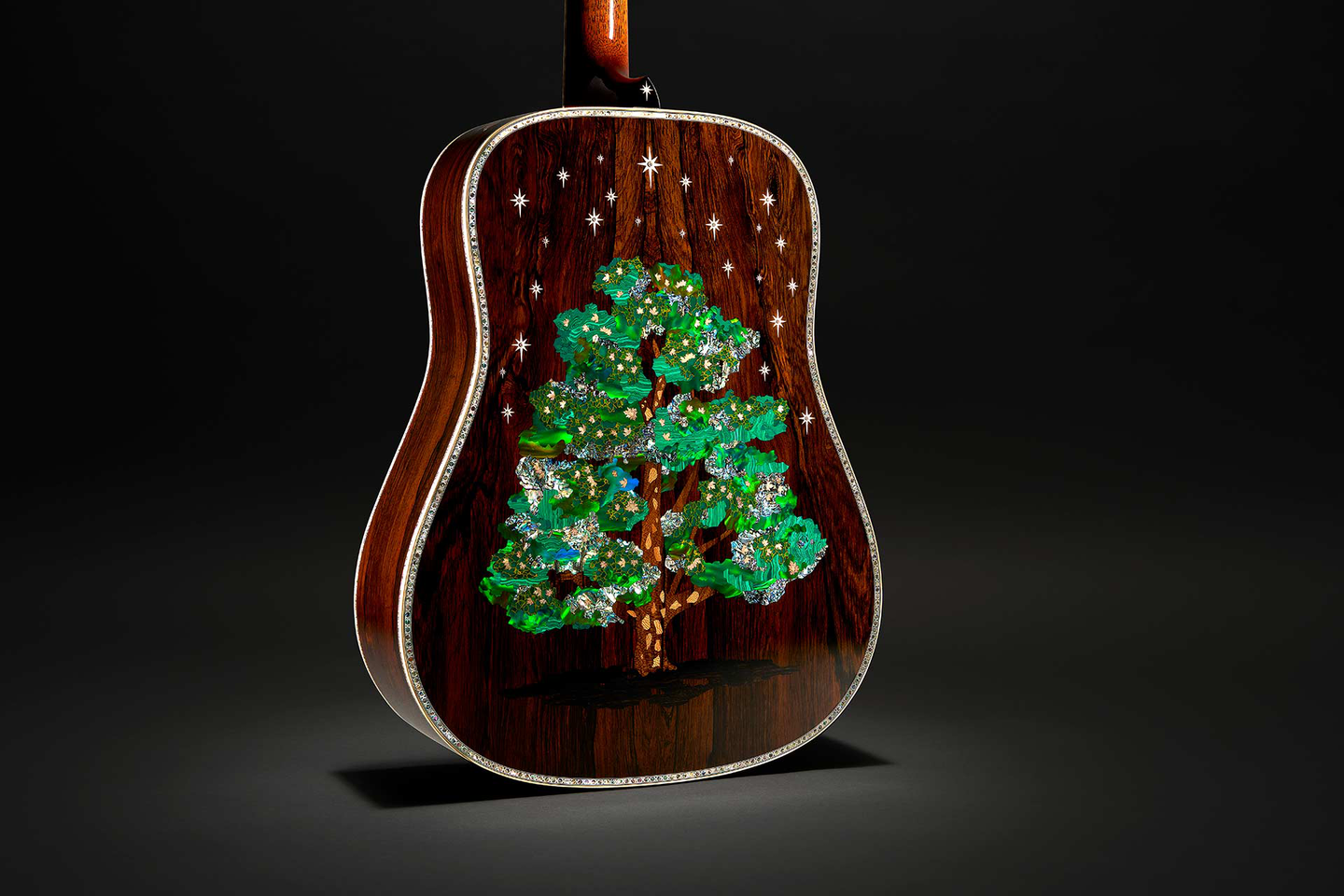 The back of the D-3-Millionth guitar featuring a green conifer tree and stars