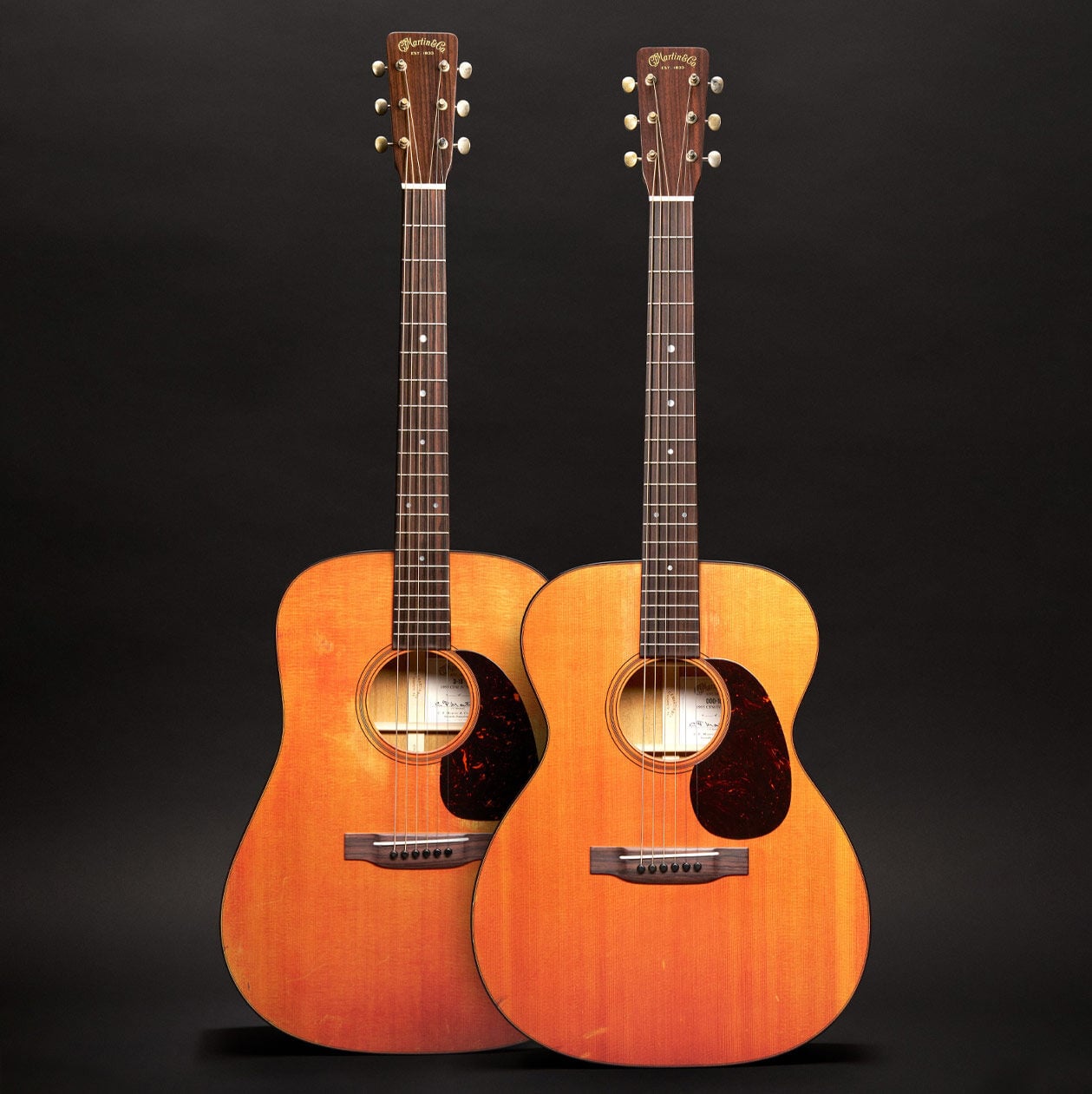 Two acoustic guitars side by side