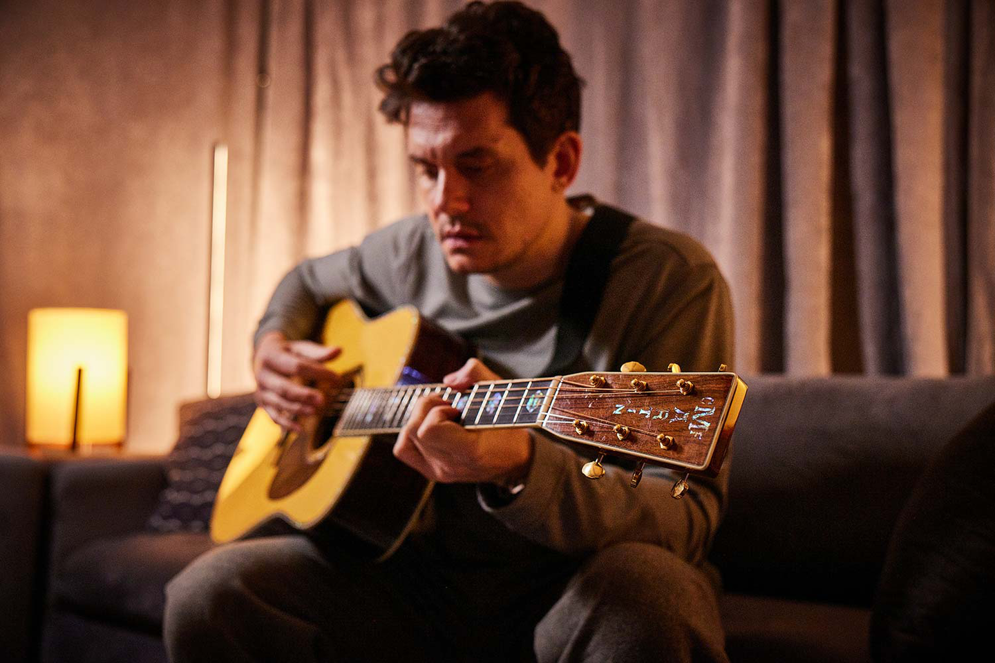 John Mayer playing his Martin guitar